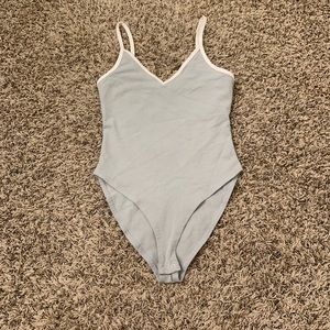 Pale green and white bodysuit